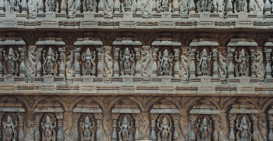 Floor to ceiling and wall to wall size exquisitely carved wooden statues and carved panels, depicting the ten main avatars of Lord Vishnu